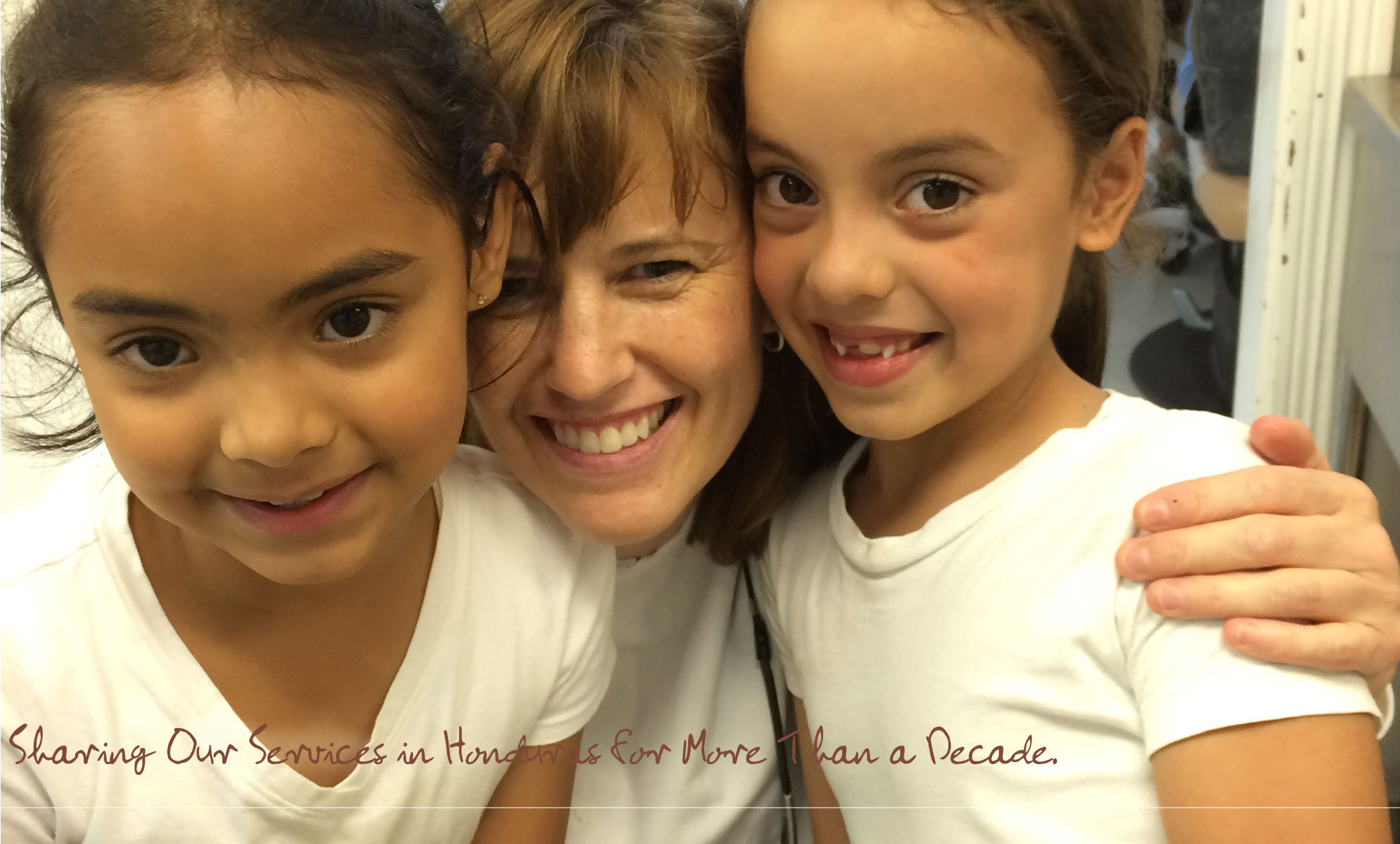 Dr. Kate Schacherl with two young girls